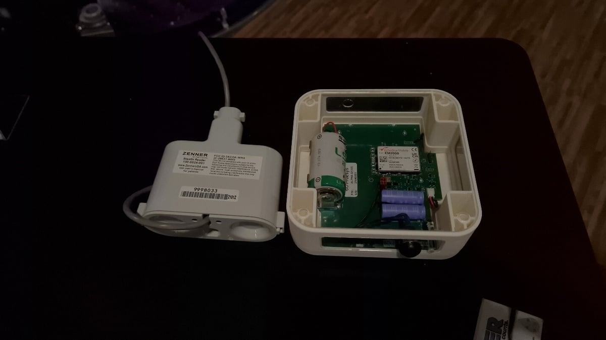 Zenner Meter Interface Unit and EchoStar LoRaWAN satellite relay device with exposed circuit board displaying satellite connectivity hardware